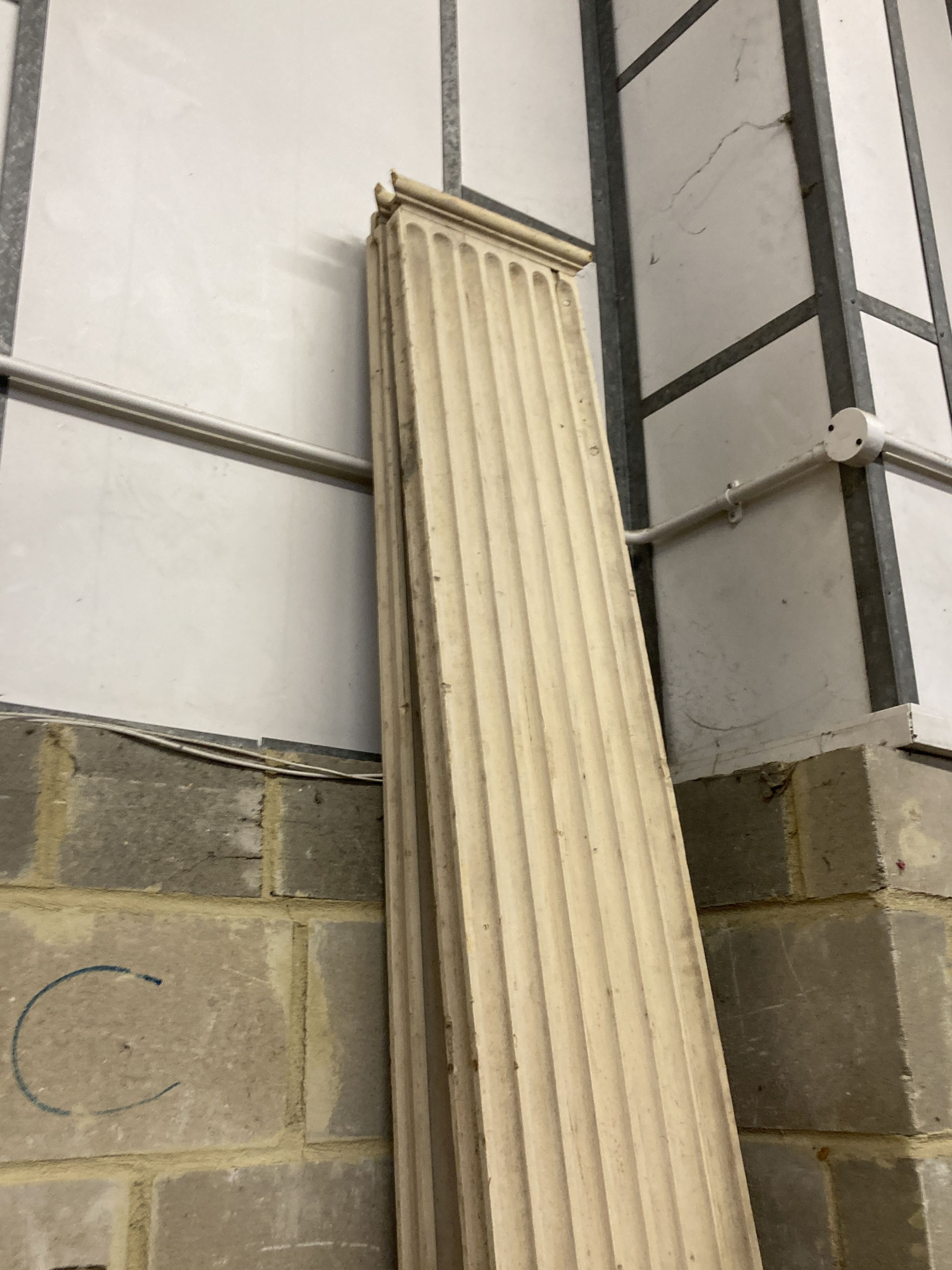 A pair of painted pine classical fluted wainscot columns, width 33cm, height 294cm